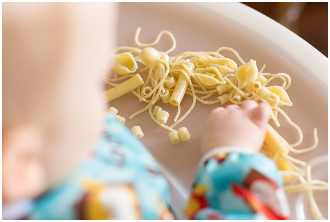 Homemade sensory play for toddlers with cold cooked pasta | Nicole Watford Photography