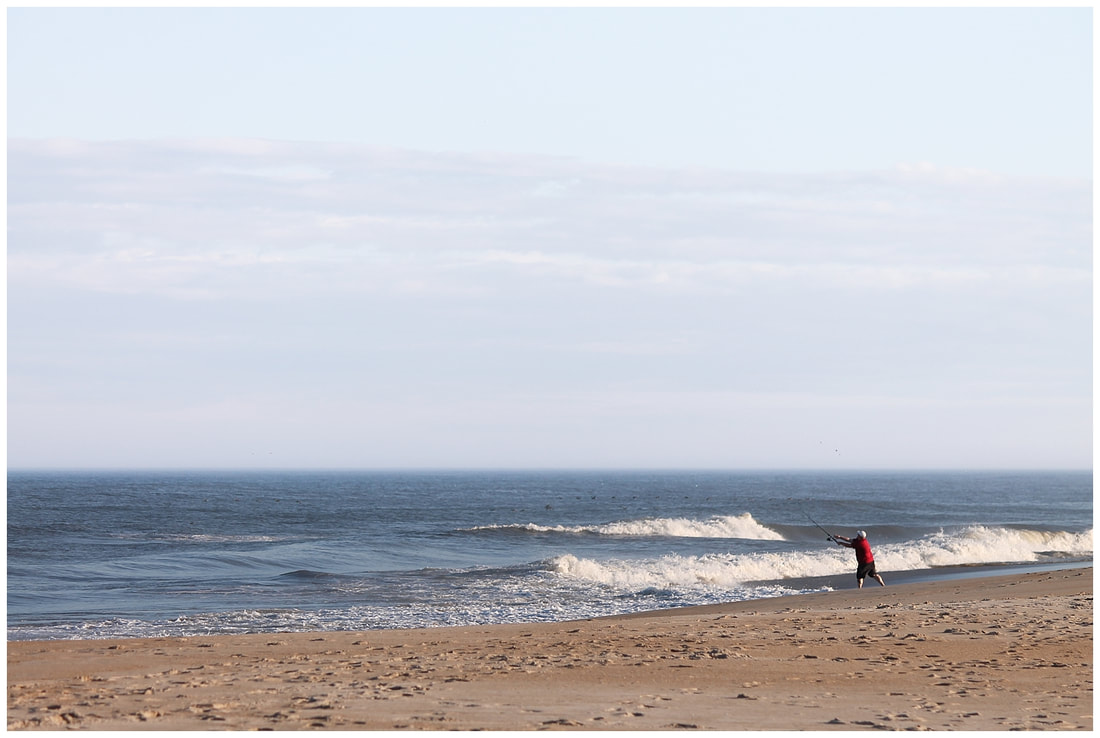 Fisherman casting a line in the Outer Banks of NC | Nicole Watford Photography