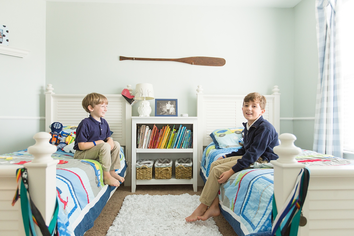 brothers sit on beds during Columbia In-Home Lifestyle Session