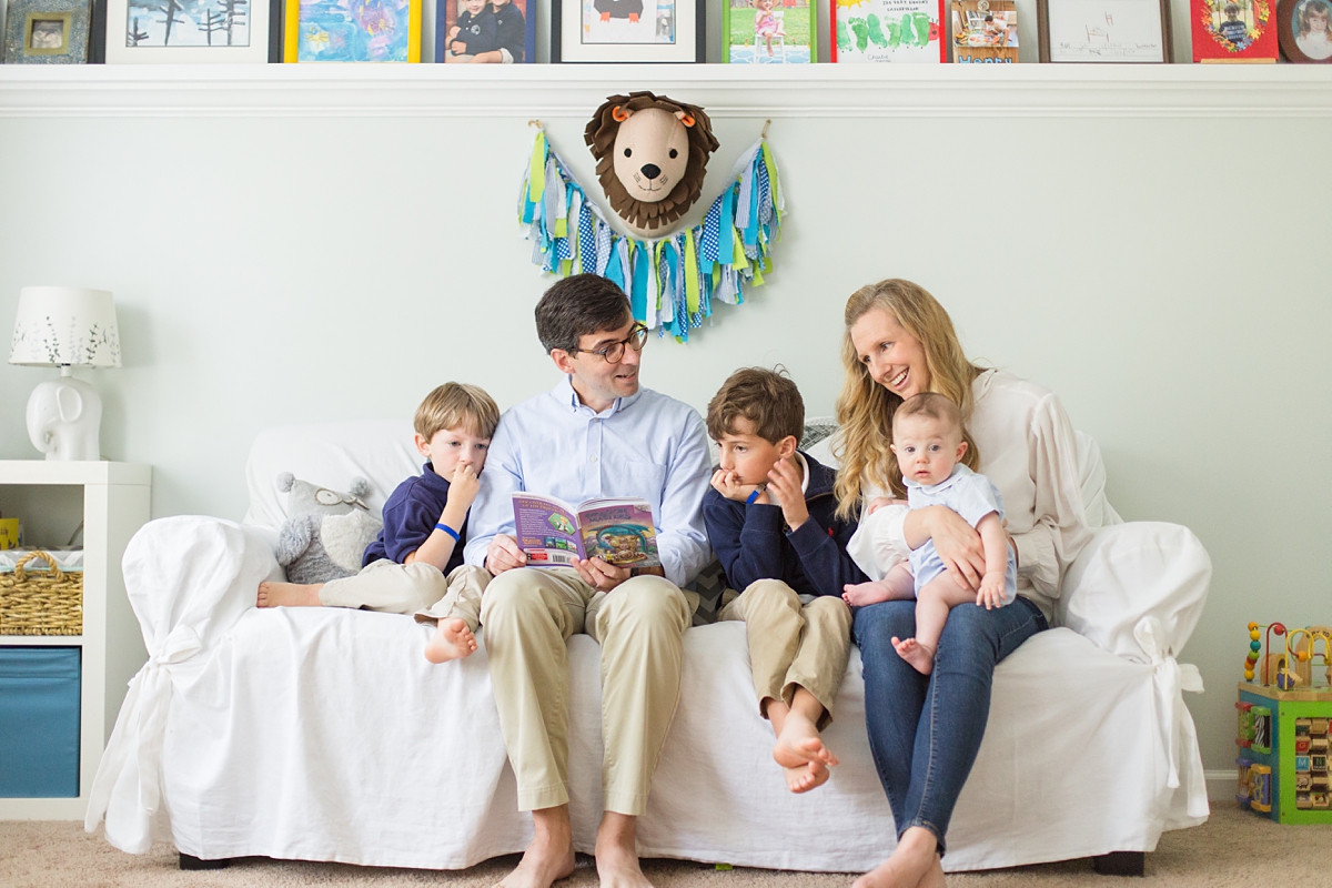 family of five sits on couch during family photos in Columbia SC home