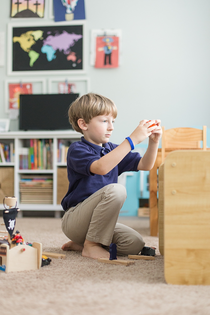 boy plays in playroom during Columbia In-Home Lifestyle Session