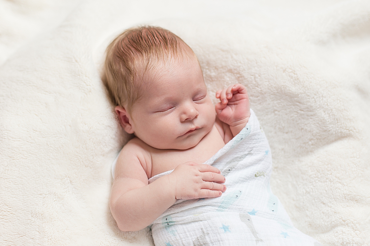 baby sleeps in pastel wrap during SC newborn photos