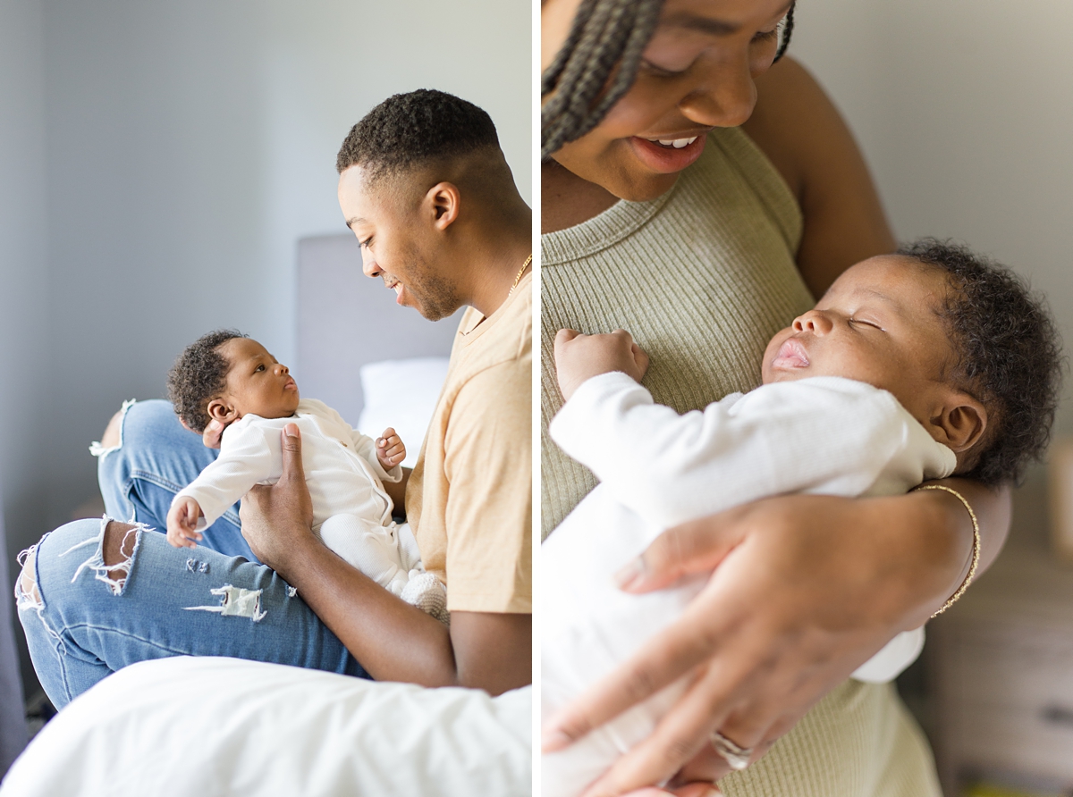 dad and mom hold baby during newborn photos at home