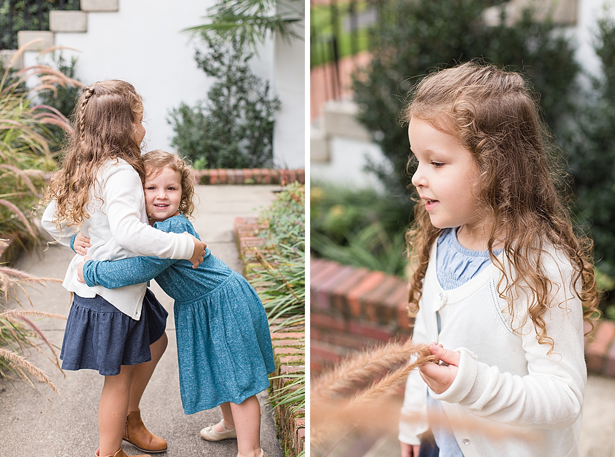 sisters play during family photos