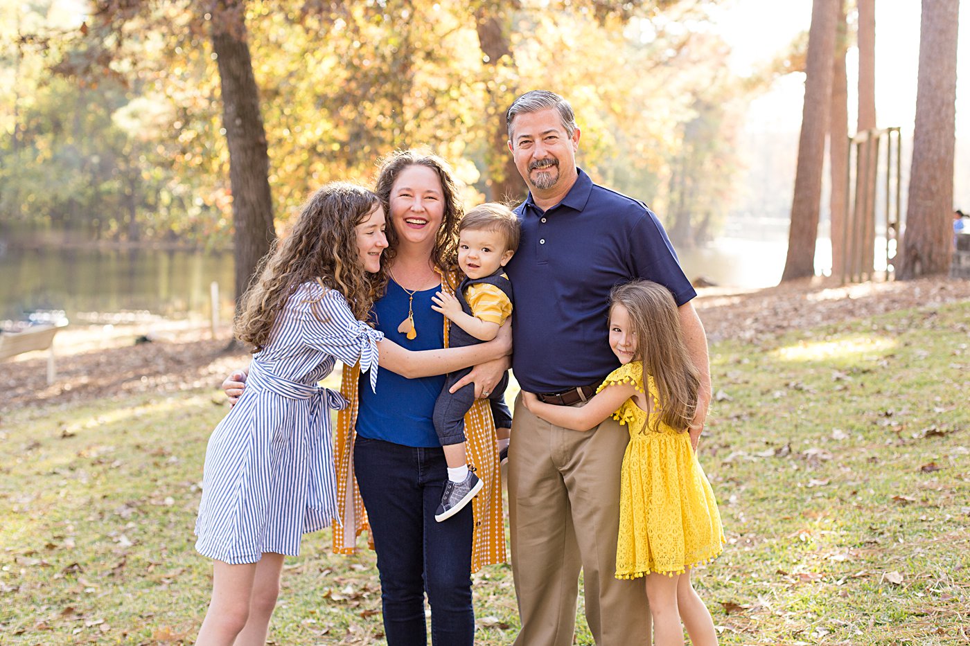 Smiling family at Gibson Pond Park in Lexington SC captured by Nicole Watford Photography